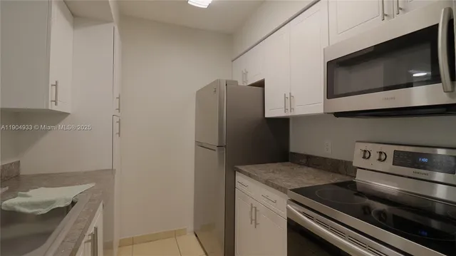 a kitchen with a stove and a microwave