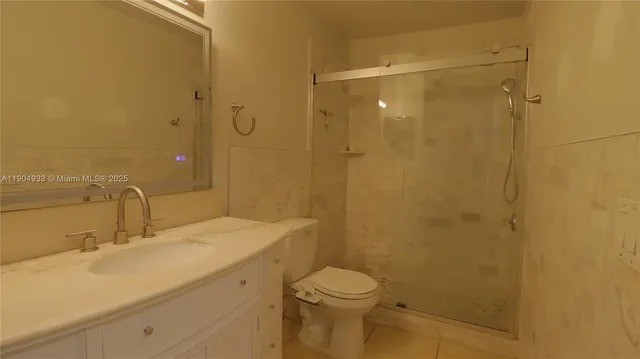 a bathroom with a shower and a toilet