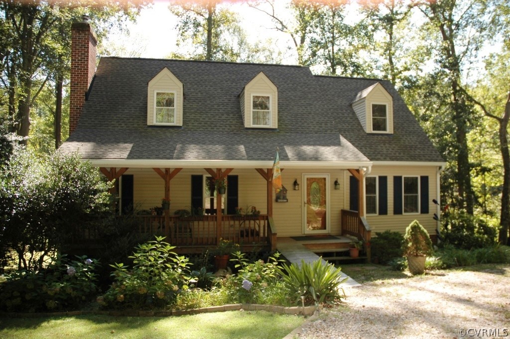 a front view of a house with a yard garage and outdoor seating