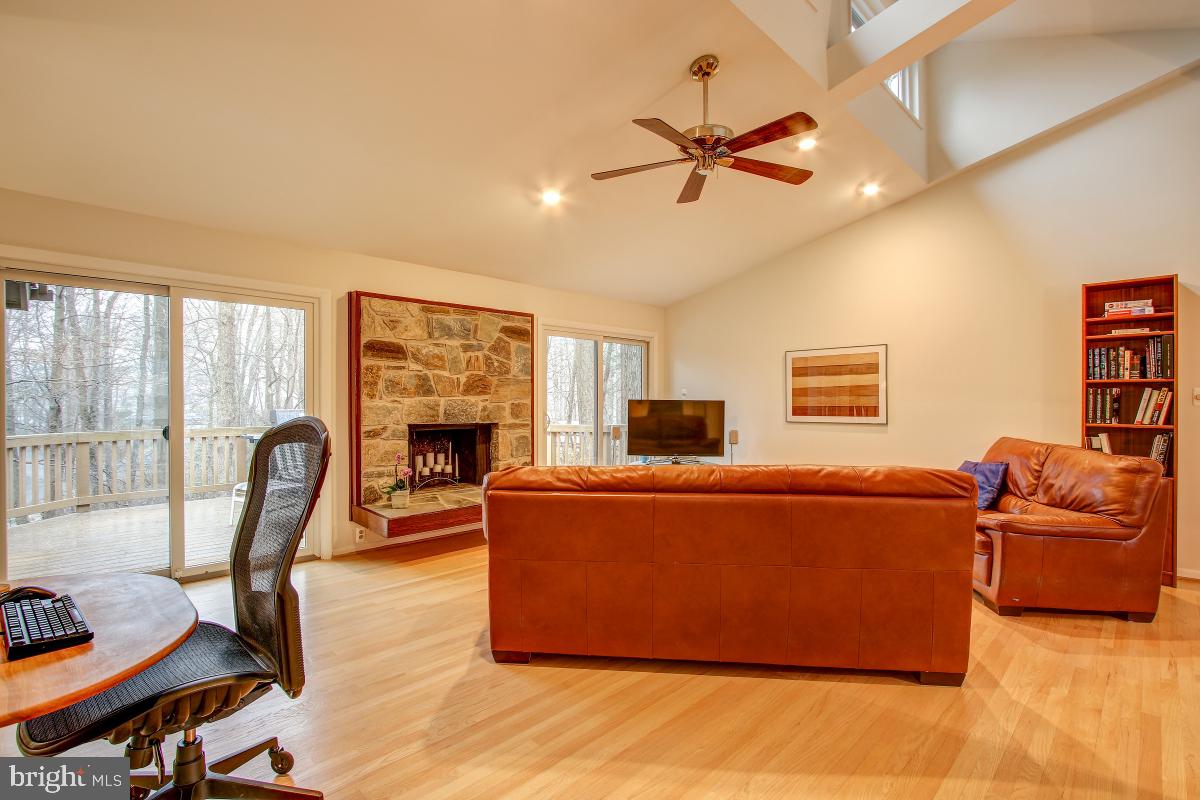 2081 Amberjack Court Reston, VA 20191 - Photo 6 of 35 Living Room opens to deck and features a fireplace