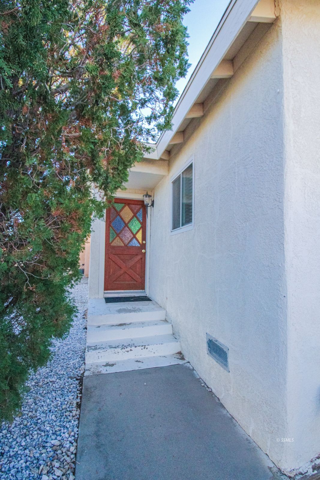 1621 Sims Street Ridgecrest, CA 93555 - Photo 3 of 24 a view of a house with a tree
