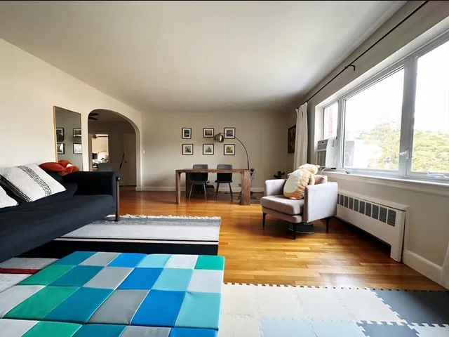 a living room with furniture and a rug