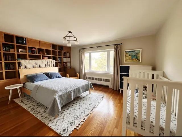 a bedroom with furniture and a window