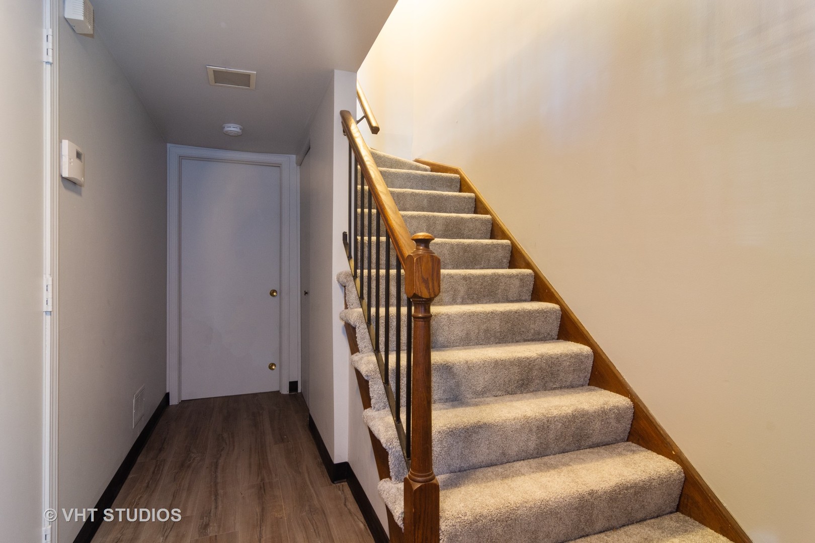 1992 Holbrook Lane Hoffman Estates, IL 60169 - Photo 11 of 14 a view of a hallway with wooden floor and entryway