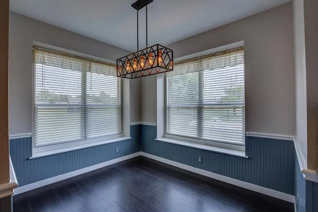 a living room with furniture and a kitchen view