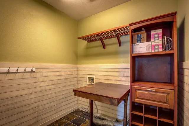 an empty room with closet and a ceiling fan