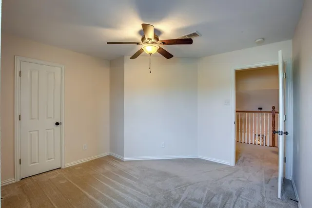a view of a house with a backyard and sitting area