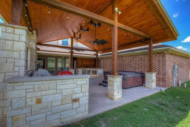 a view of a yard with furniture and a fire pit