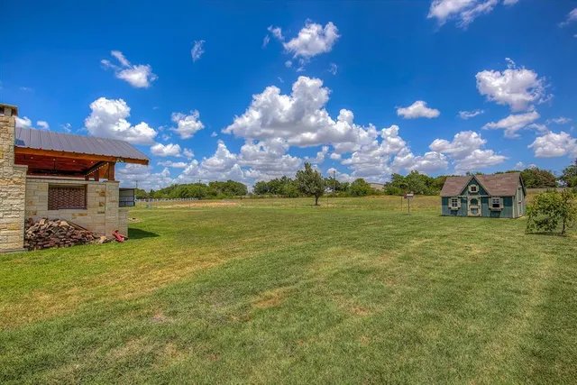 a view of a house with a big yard