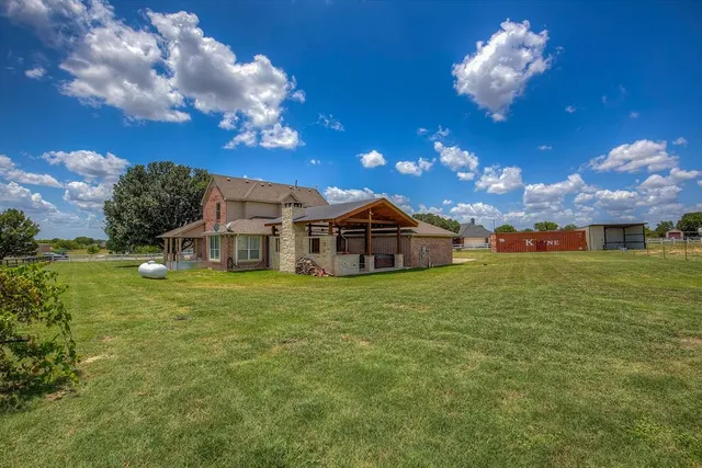 a view of a house with a big yard