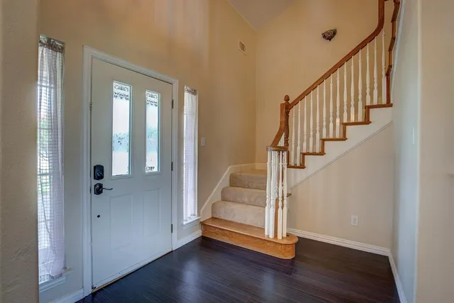 a view of entryway with wooden floor