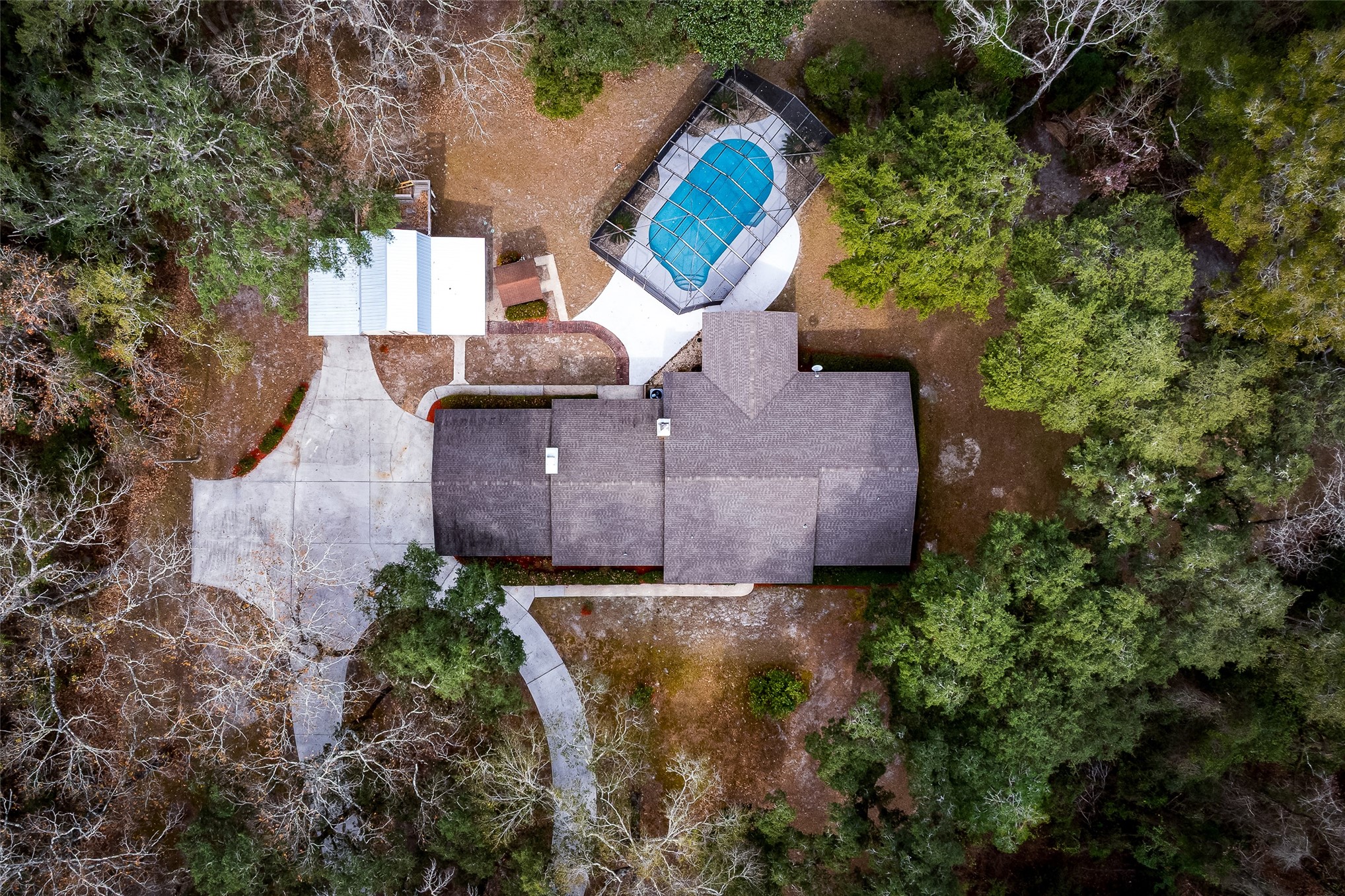 28175 Hammock Road Hilliard, FL 32046 - Photo 12 of 33 an aerial view of a house with a garden and trees