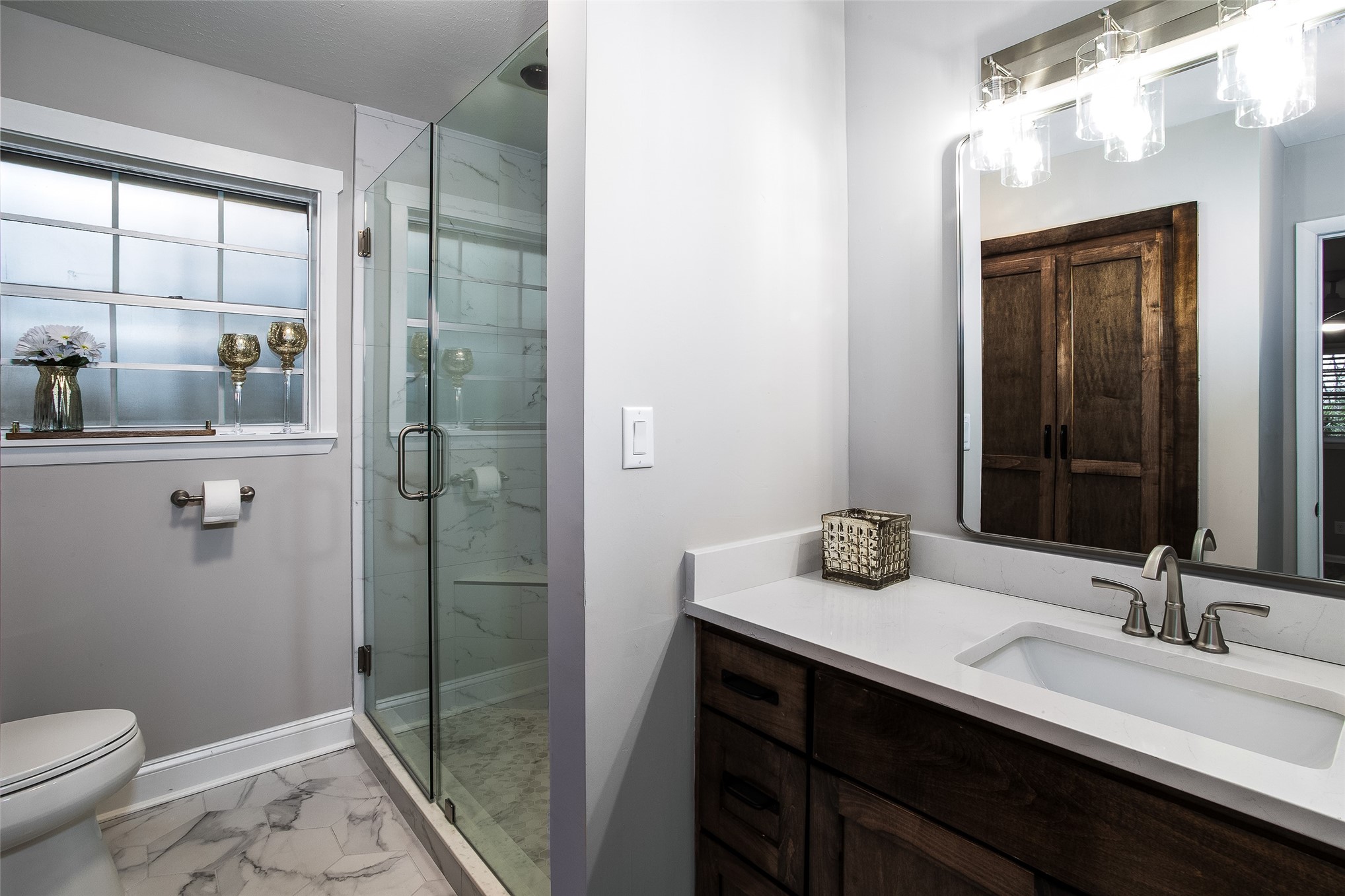 28175 Hammock Road Hilliard, FL 32046 - Photo 18 of 33 a bathroom with a granite countertop sink a toilet and shower