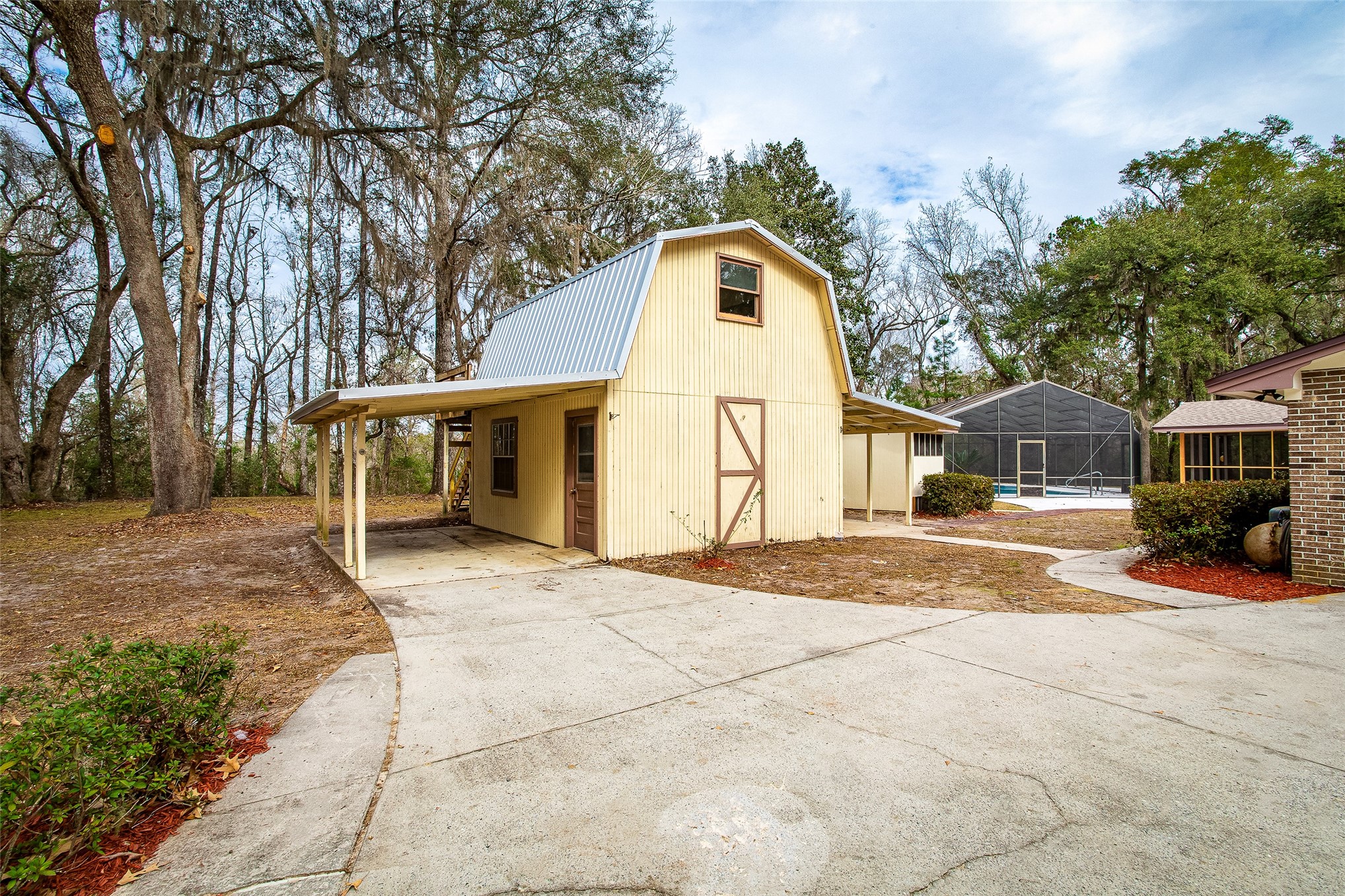 28175 Hammock Road Hilliard, FL 32046 - Photo 20 of 33 a view of a house with a yard and large tree