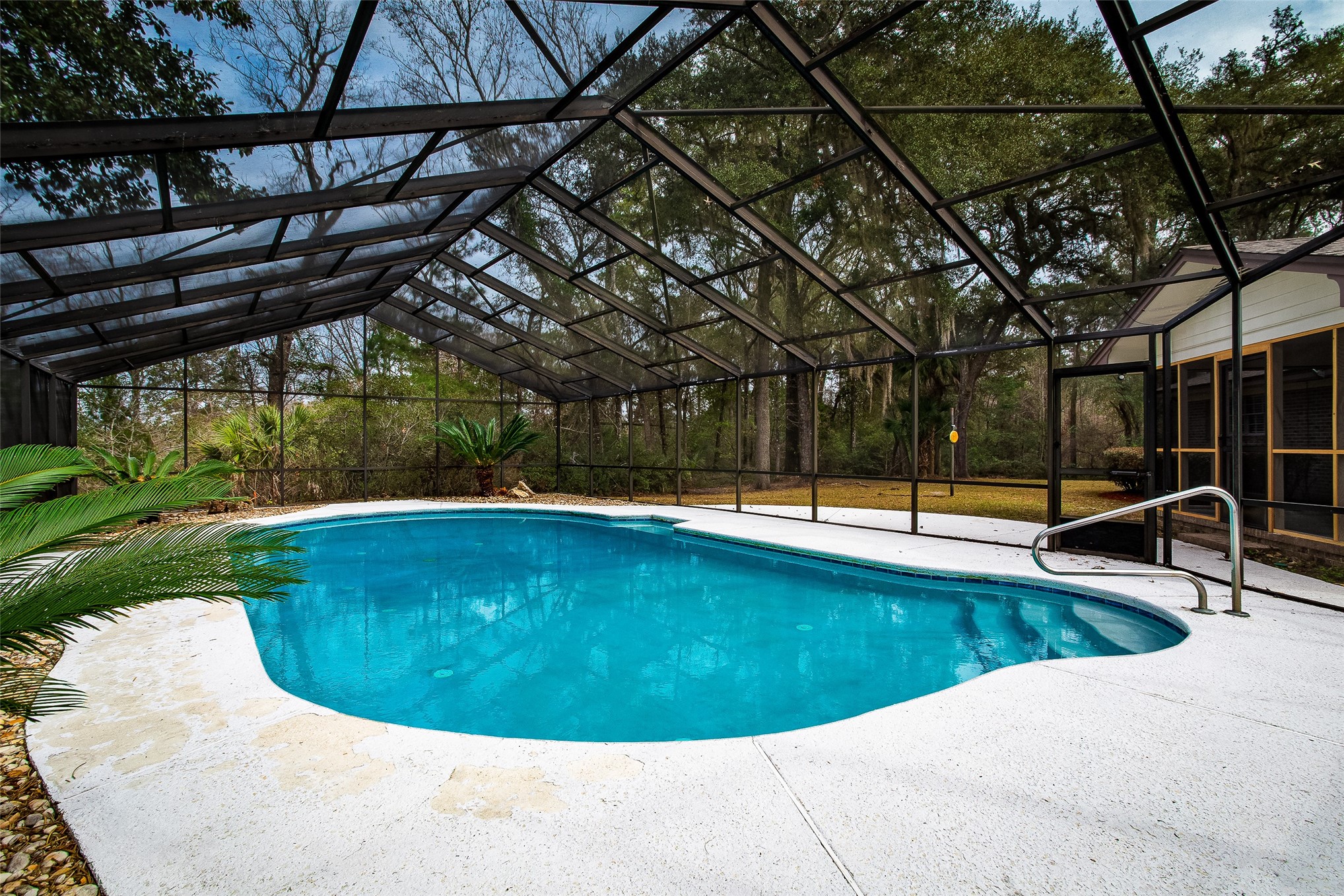 28175 Hammock Road Hilliard, FL 32046 - Photo 26 of 33 a view of a swimming pool with a patio