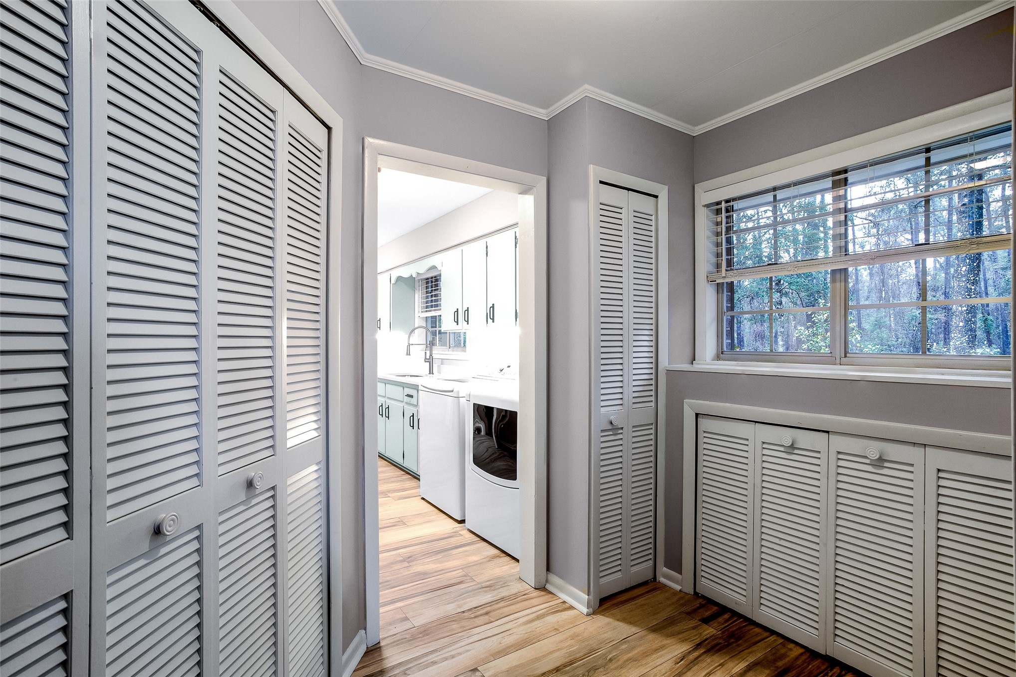 28175 Hammock Road Hilliard, FL 32046 - Photo 28 of 33 a view of a hallway with wooden floor and staircase