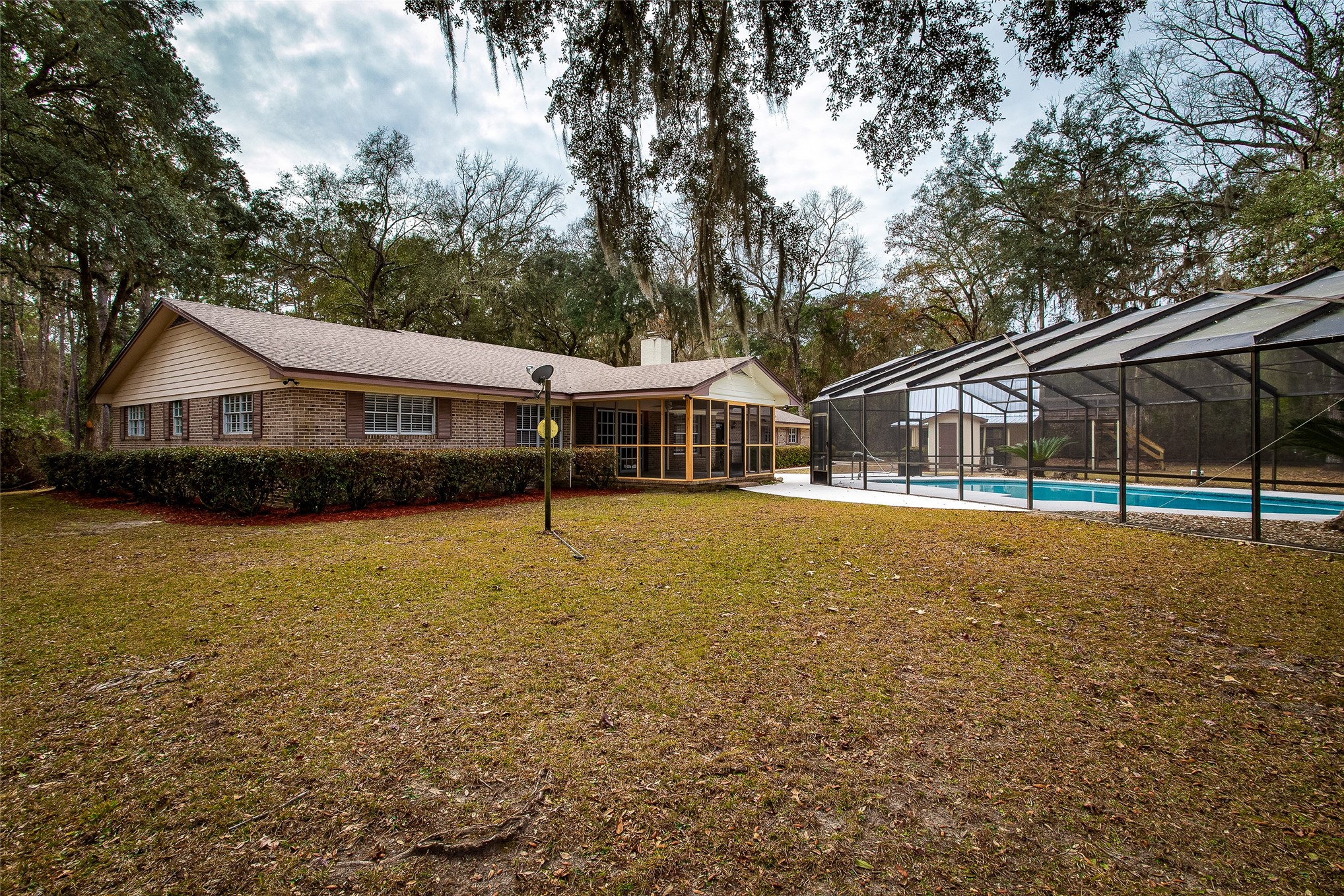28175 Hammock Road Hilliard, FL 32046 - Photo 5 of 33 a view of house with a swimming pool