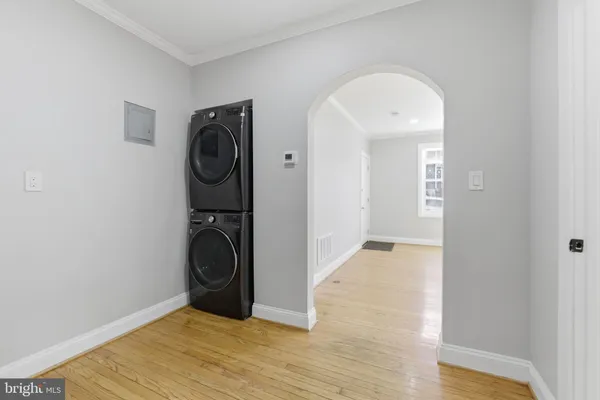 a view of a storage & utility room with wooden floor
