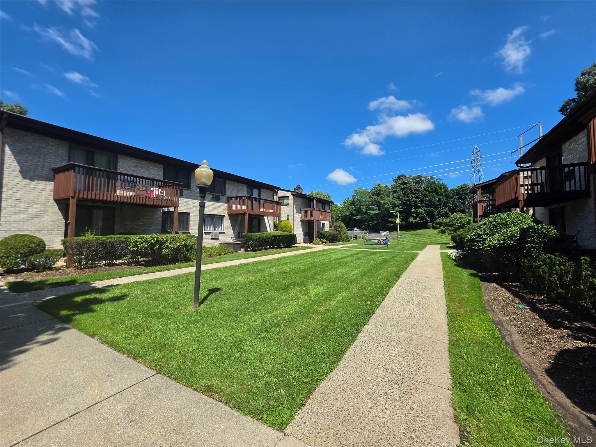 5 Secora Road, Unit F2 Spring Valley, NY 10977 - Photo 18 of 22 View from Building to parking lot