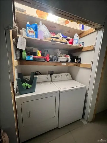 a utility room with washer and dryer