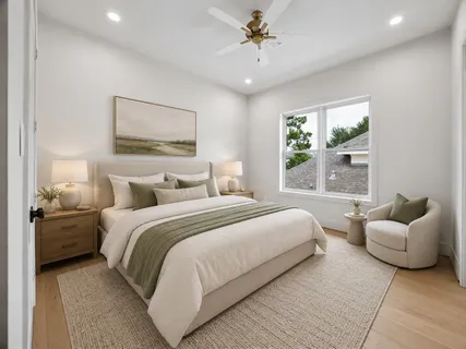 an empty room with wooden floor chandelier fan and windows