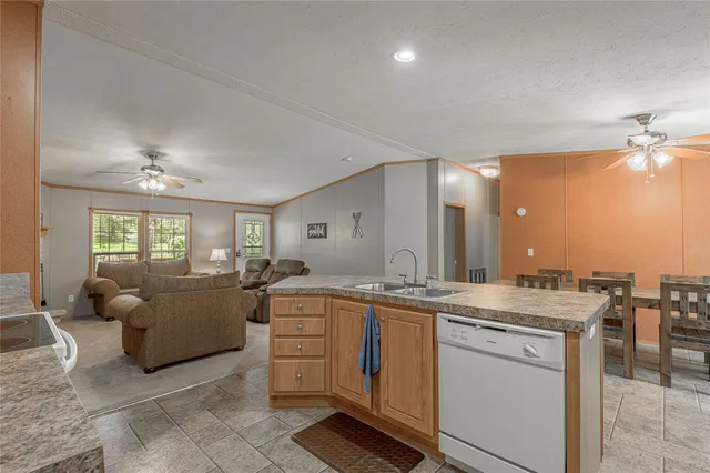 a view of a livingroom with furniture and windows