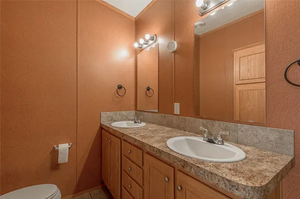 a bedroom with furniture and a fireplace