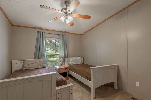 a balcony with wooden floor and outdoor seating