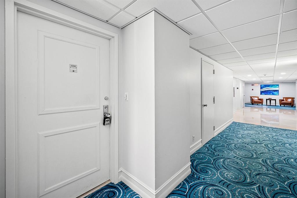 a view of a hallway to a bedroom