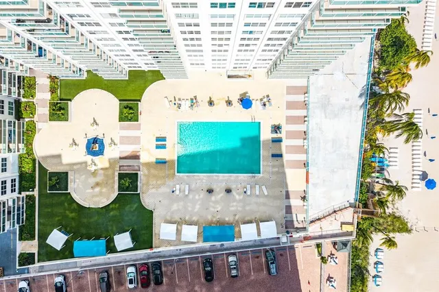 a living room filled with furniture and a flat screen tv