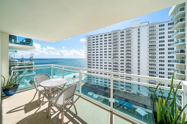 a view of a balcony with a potted plant