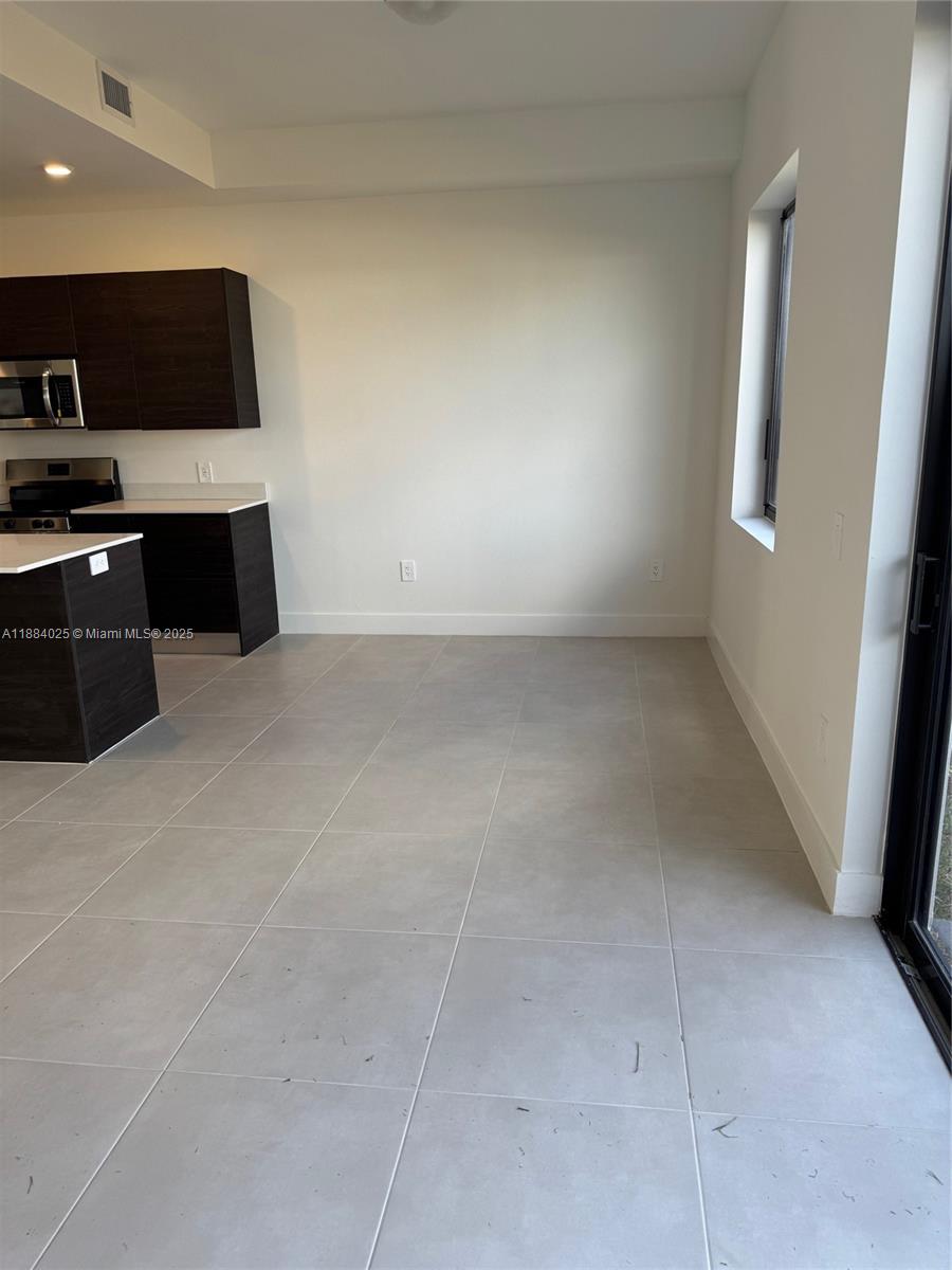 18941 Southwest 344th Terrace Homestead, FL 33034 - Photo 4 of 14 a view of kitchen and microwave