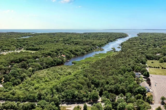 an aerial view of beach and ocean