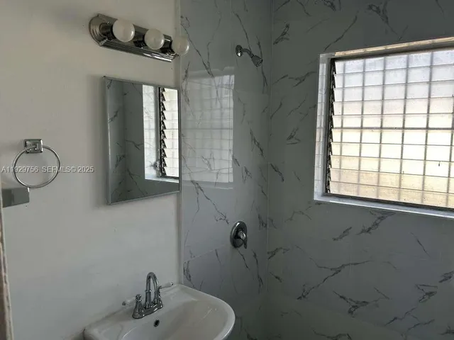 a bathroom with a toilet and a sink
