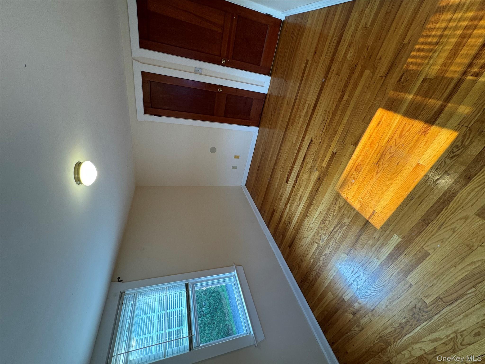 560 State Rte 44 55, Unit D Highland, NY 12528 - Photo 12 of 13 Empty room with baseboards and hardwood / wood-style floors