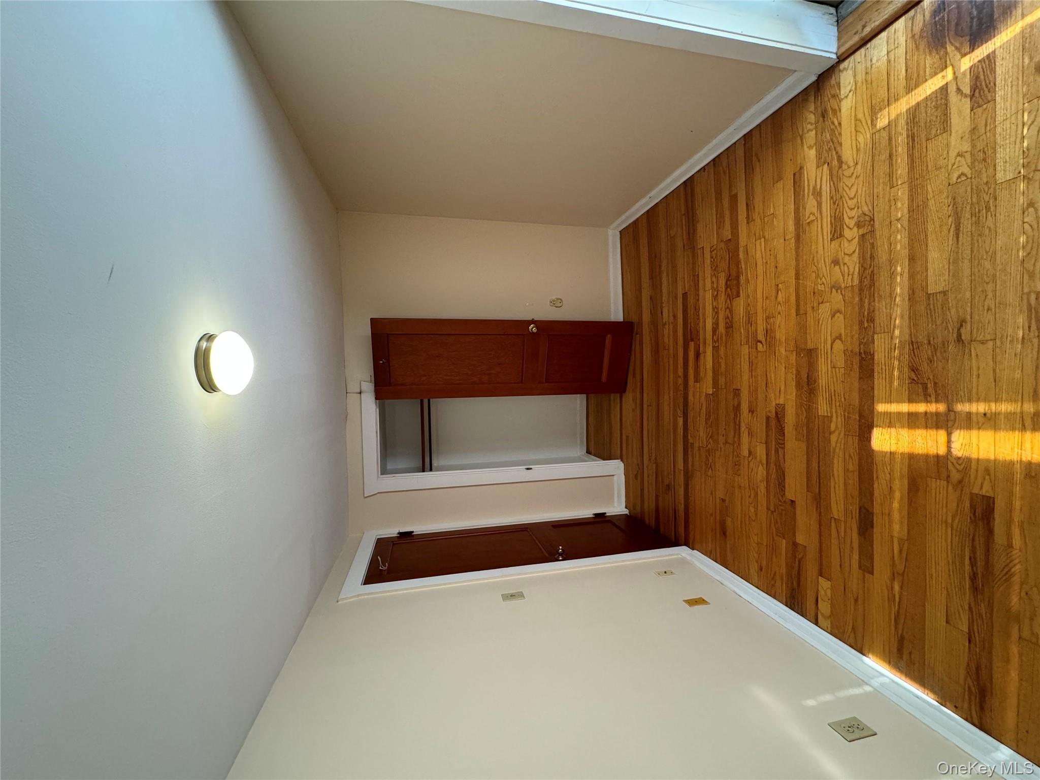 560 State Rte 44 55, Unit D Highland, NY 12528 - Photo 3 of 13 Unfurnished bedroom featuring light wood finished floors and a closet