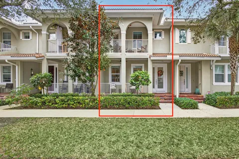 front view of a house with a garden