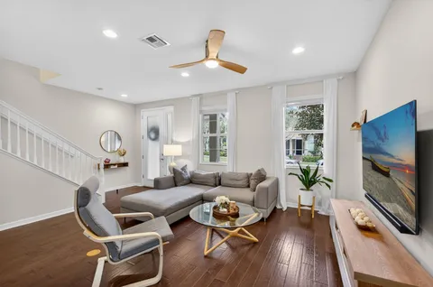 a living room with furniture fireplace and a flat screen tv