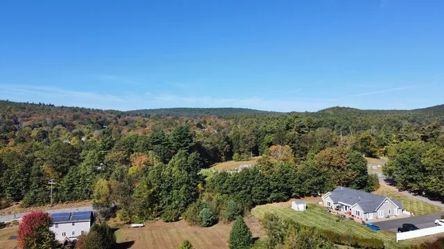 an aerial view of a house with mountain view