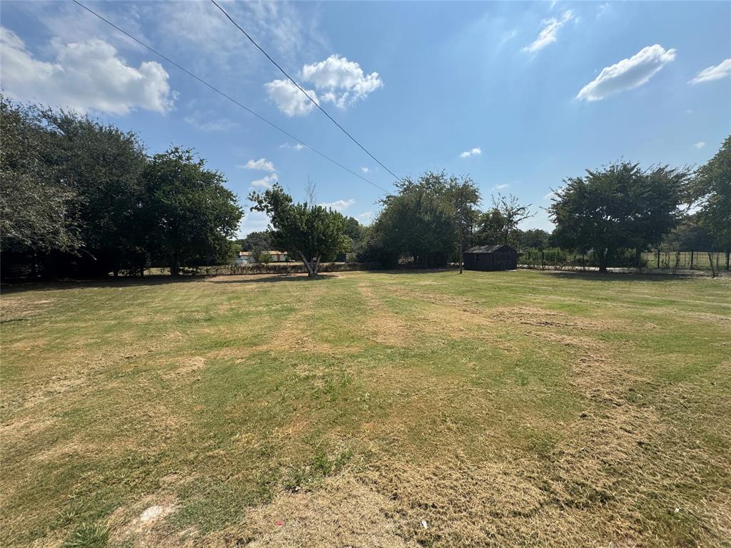 201 Donna Street Alvarado, TX 76009 - Photo 14 of 14 a view of a swimming pool and a yard