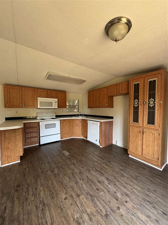 201 Donna Street Alvarado, TX 76009 - Photo 2 of 14 a view of a kitchen with a sink stove cabinets and empty room