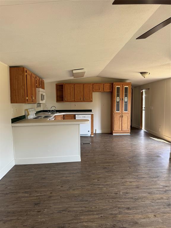 201 Donna Street Alvarado, TX 76009 - Photo 3 of 14 a view of kitchen with stainless steel appliances granite countertop a stove top oven a sink and a microwave