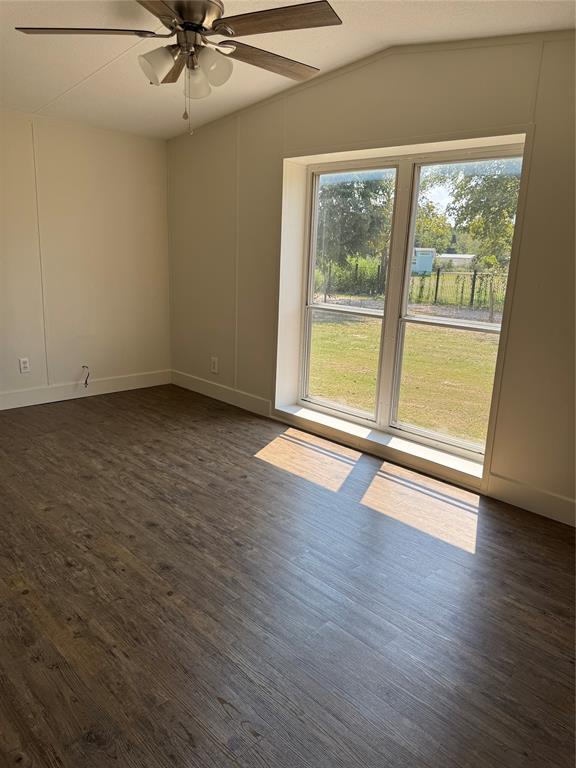 201 Donna Street Alvarado, TX 76009 - Photo 8 of 14 a view of an empty room with wooden floor and a window