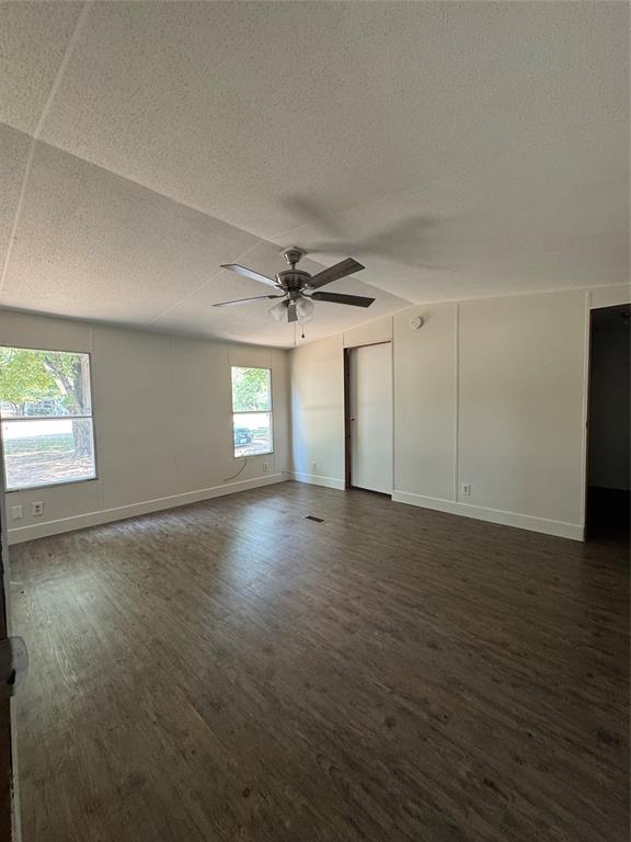 201 Donna Street Alvarado, TX 76009 - Photo 10 of 14 an empty room with wooden floor and windows
