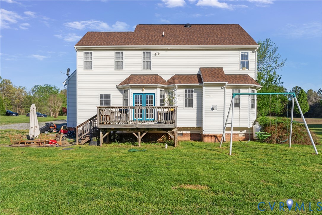 15286 Devonwood Road Montpelier, VA 23192 - Photo 18 of 50 Rear view of house with a wooden deck, a lawn, and