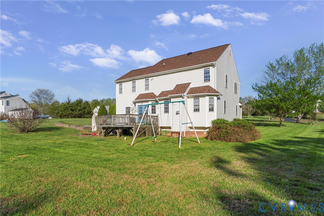 15286 Devonwood Road Montpelier, VA 23192 - Photo 19 of 50 Back of house featuring a deck and a yard