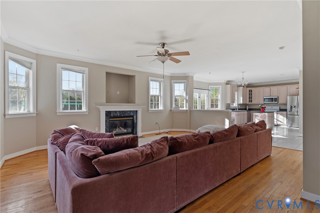 15286 Devonwood Road Montpelier, VA 23192 - Photo 26 of 50 Living area featuring ceiling fan, crown molding,