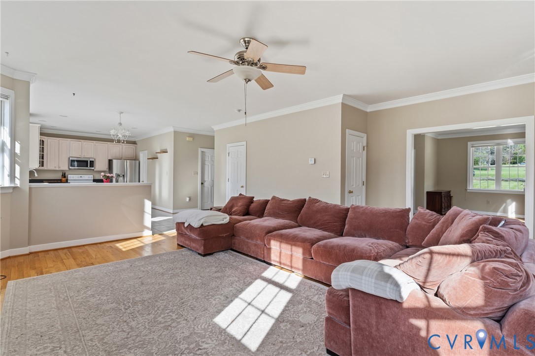 15286 Devonwood Road Montpelier, VA 23192 - Photo 28 of 50 Living room with ornamental molding, ceiling fan,