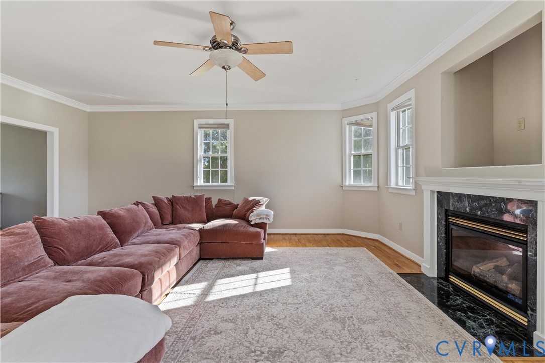 15286 Devonwood Road Montpelier, VA 23192 - Photo 29 of 50 Living room with a ceiling fan, crown molding, a h