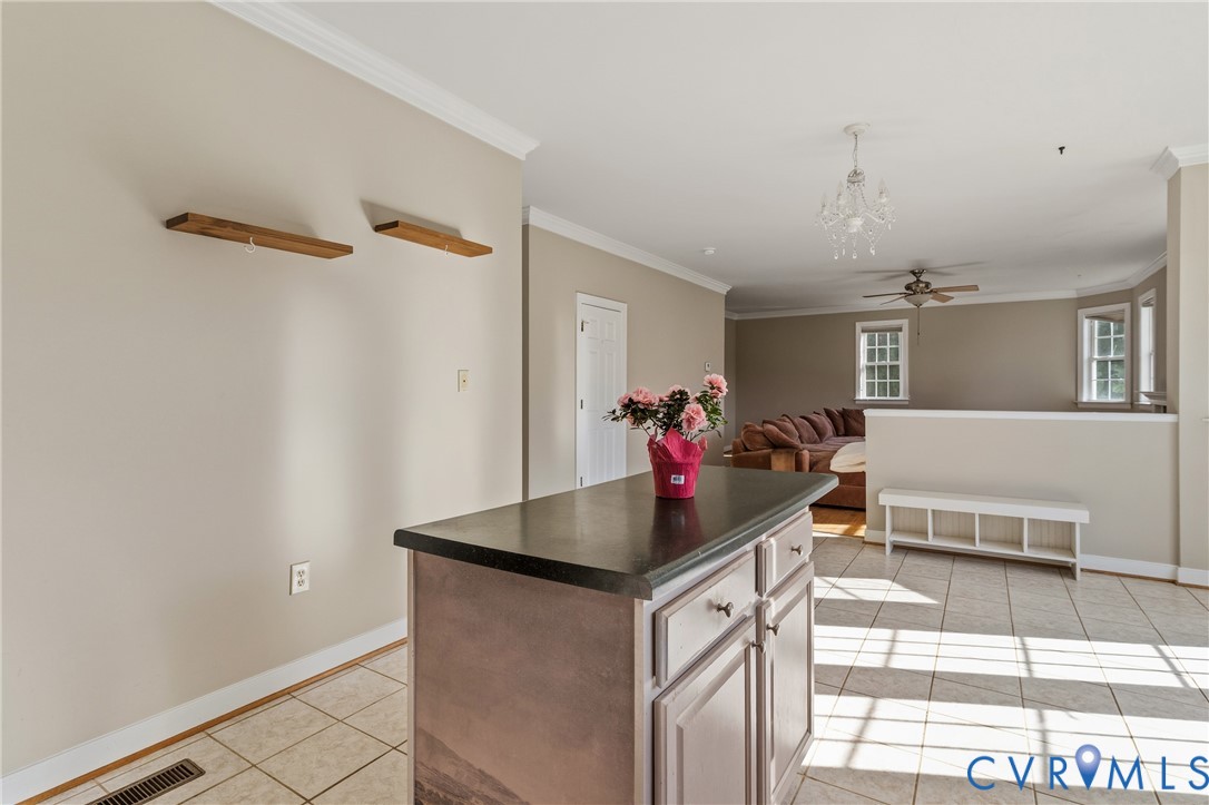 15286 Devonwood Road Montpelier, VA 23192 - Photo 33 of 50 Kitchen with ornamental molding, a center island,